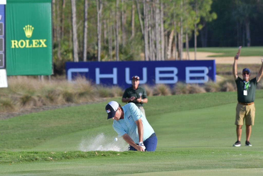 Billy Andrade out of the bunker on 18.